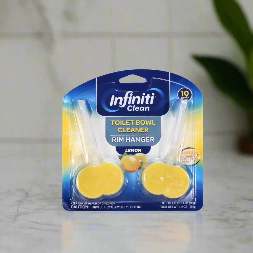 Packaging of Infiniti Clean Toilet Bowl Cleaner with lemon scent on a bathroom floor.
